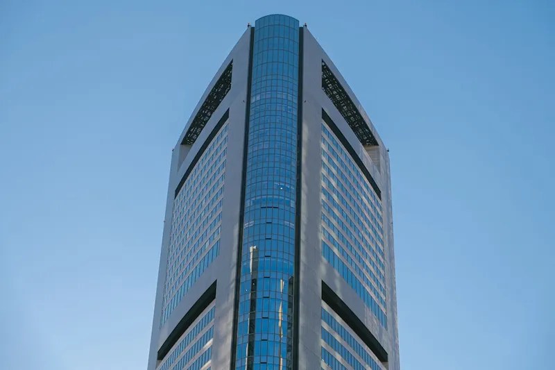 Modern skyscraper against a clear blue sky.